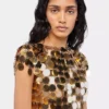 Den gullfargede Sparkle Disc-toppen