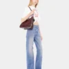 Flared jeans pyntet med 1969-skiver