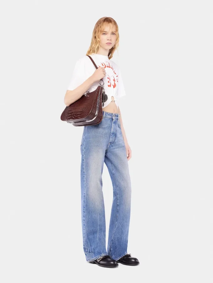 Flared jeans pyntet med 1969-skiver