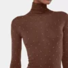 Turtleneck-top i ull som sitter som et ekstra hudlag